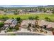 Aerial view of well-kept homes in neighborhood, showcasing desert landscaping and paved roads and proximity to grassy park space at 4239 W Reddie Loop, Phoenix, AZ 85083