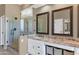 Bright bathroom features walk in shower, double vanity, and granite countertop at 4239 W Reddie Loop, Phoenix, AZ 85083