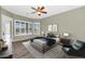 Comfortable bedroom with large windows and a view of the pool at 4239 W Reddie Loop, Phoenix, AZ 85083