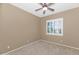 Neutral bedroom with ceiling fan, window with shutters, and carpet at 4239 W Reddie Loop, Phoenix, AZ 85083