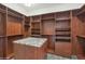 Spacious walk-in closet with custom shelving and storage space at 4239 W Reddie Loop, Phoenix, AZ 85083
