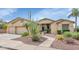Charming single-story home featuring desert landscaping and a two-car garage at 4239 W Reddie Loop, Phoenix, AZ 85083