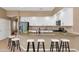 This kitchen features a breakfast bar with seating and modern appliances at 4239 W Reddie Loop, Phoenix, AZ 85083