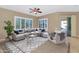 Beautiful living room with large windows and modern stylish furniture at 4239 W Reddie Loop, Phoenix, AZ 85083