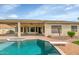 Swimming pool featuring a diving board and expansive desert landscaping at 4239 W Reddie Loop, Phoenix, AZ 85083