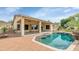 Backyard oasis boasts a large pool, covered patio and desert landscaping at 4239 W Reddie Loop, Phoenix, AZ 85083