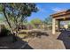 Landscaped backyard featuring a pool with surrounding safety fence and an adjacent covered patio at 4338 E Hamblin Dr, Phoenix, AZ 85050
