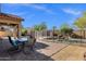 Inviting backyard with fenced pool, covered patio, and outdoor dining area, perfect for relaxing and entertaining at 4338 E Hamblin Dr, Phoenix, AZ 85050
