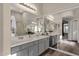 Elegant bathroom featuring dual sinks and large mirrors at 4338 E Hamblin Dr, Phoenix, AZ 85050