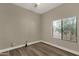 Well-lit bedroom with wood floors and neutral paint colors at 4338 E Hamblin Dr, Phoenix, AZ 85050