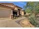 Inviting single-story home with a two-car garage and desert-friendly landscaping at 4338 E Hamblin Dr, Phoenix, AZ 85050