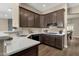 Well-equipped kitchen with granite countertops, ample cabinetry, and hardwood floors at 4338 E Hamblin Dr, Phoenix, AZ 85050