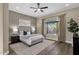 Comfortable main bedroom with neutral colors and a ceiling fan at 4338 E Hamblin Dr, Phoenix, AZ 85050