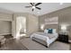 Well-lit main bedroom featuring neutral walls and wood floors at 4338 E Hamblin Dr, Phoenix, AZ 85050