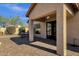 Covered patio with tiled pavers and a ceiling fan offers a place to relax or entertain at 4338 E Hamblin Dr, Phoenix, AZ 85050