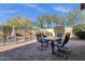 Backyard patio with table and chairs near the pool at 4338 E Hamblin Dr, Phoenix, AZ 85050