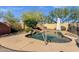 Beautiful backyard pool with rock accents, surrounding desert landscaping, and ample space for enjoying the outdoors at 4338 E Hamblin Dr, Phoenix, AZ 85050