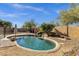 Sparkling backyard pool featuring stone accents, desert landscaping, and a relaxing outdoor seating area at 4338 E Hamblin Dr, Phoenix, AZ 85050