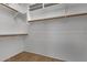 Empty walk-in closet with shelving and rods for organization at 4338 E Hamblin Dr, Phoenix, AZ 85050