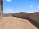 Expansive, blank canvas backyard with block wall, offering privacy and possibilities for customization and landscaping at 5573 S 246Th Ave, Buckeye, AZ 85326
