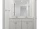 Bathroom with double sink vanity and ample storage; bright and well-maintained at 5573 S 246Th Ave, Buckeye, AZ 85326