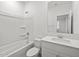 Clean, bright bathroom featuring a shower over tub and a vanity with a sink and ample counter space at 5573 S 246Th Ave, Buckeye, AZ 85326