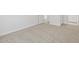 Bedroom featuring neutral carpet flooring and baseboard trim, offering a clean and inviting space at 5573 S 246Th Ave, Buckeye, AZ 85326