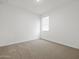 Bedroom bathed in natural light, with plush carpet providing a soft and comfortable flooring option at 5573 S 246Th Ave, Buckeye, AZ 85326