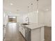 Modern kitchen features a spacious island with stone countertops and stainless steel appliances at 5573 S 246Th Ave, Buckeye, AZ 85326