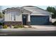 Charming single-story home featuring a two-car garage, stone accents, and low-maintenance landscaping at 5573 S 246Th Ave, Buckeye, AZ 85326
