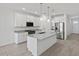 Bright kitchen with granite countertops, stainless steel appliances, and pendant lighting at 5573 S 246Th Ave, Buckeye, AZ 85326