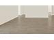 Neutral tile flooring throughout the living room of this home at 5573 S 246Th Ave, Buckeye, AZ 85326