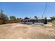 View of the home from the large backyard at 6012 W Flower St, Phoenix, AZ 85033