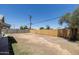 Spacious lot with wood privacy fence and mature trees at 6012 W Flower St, Phoenix, AZ 85033