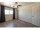 Bright bedroom with gray curtains, light floors and a view at 6012 W Flower St, Phoenix, AZ 85033