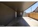 Attached carport featuring painted walls and fencing at 6012 W Flower St, Phoenix, AZ 85033