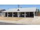 Cozy single-story home with a covered front porch and driveway at 6012 W Flower St, Phoenix, AZ 85033