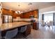 Spacious kitchen with stainless steel appliances, granite countertops, and a breakfast bar at 6012 W Flower St, Phoenix, AZ 85033