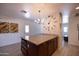 Kitchen island with granite countertop, breakfast bar, and modern pendant lighting at 6012 W Flower St, Phoenix, AZ 85033