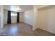 Spacious living room featuring new tile flooring, fresh paint, and natural light at 6012 W Flower St, Phoenix, AZ 85033