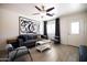Stylish living room features a gray sofa, accent chairs, and modern art at 6012 W Flower St, Phoenix, AZ 85033