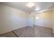 Bright living room with tile flooring and fresh paint throughout the space at 6012 W Flower St, Phoenix, AZ 85033