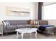 Comfortable living room features a gray sectional, stylish decor, and bright natural light at 6012 W Flower St, Phoenix, AZ 85033