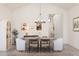 Dining area with an oval table and seating under a chandelier at 667 E Brown Way, San Tan Valley, AZ 85140
