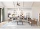 Cozy living area featuring an open layout, modern kitchen, stylish furniture, and a ceiling fan at 667 E Brown Way, San Tan Valley, AZ 85140