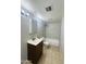 Bathroom featuring a single sink vanity and a shower-tub combo with tile surround at 7126 N 19Th Ave # 224, Phoenix, AZ 85021