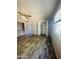 Bedroom featuring stylish wood-look flooring, a ceiling fan, and a closet at 7126 N 19Th Ave # 224, Phoenix, AZ 85021