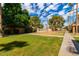 Scenic view of a community lawn with palm trees, and a swimming pool at 7126 N 19Th Ave # 224, Phoenix, AZ 85021