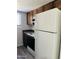 Cozy kitchen features a white refrigerator and wooden cabinets at 7126 N 19Th Ave # 224, Phoenix, AZ 85021