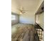 Living room view from stairs with wood look flooring and ceiling fan at 7126 N 19Th Ave # 224, Phoenix, AZ 85021